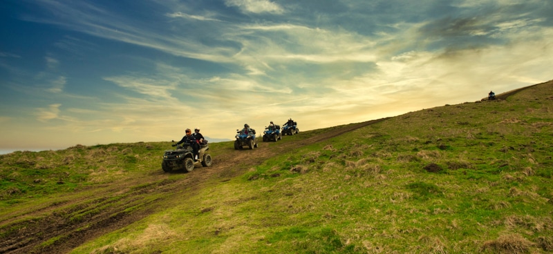 group riding atv in open field