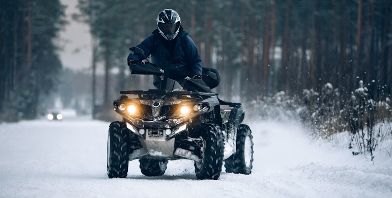 quad riding in the snow