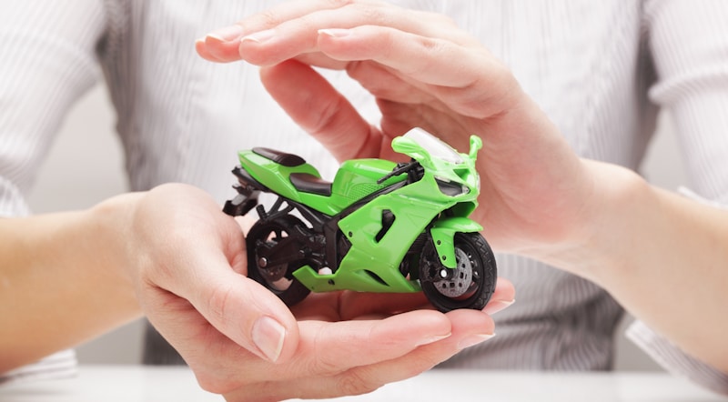 green rc motorcycle in womans hands