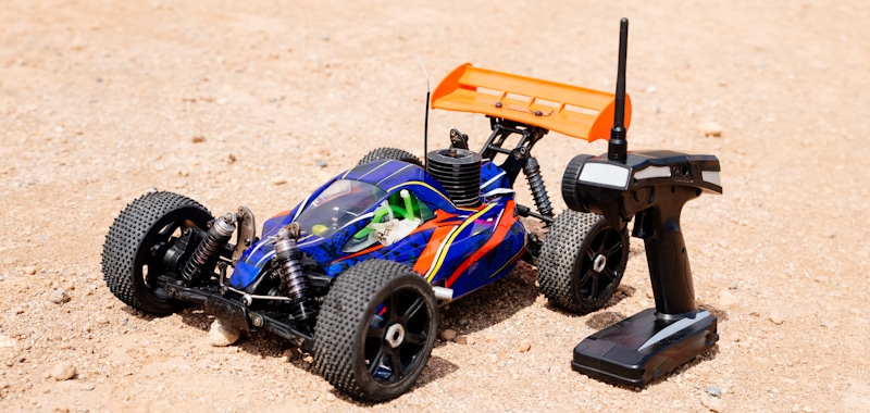 rc car and controller in the ground