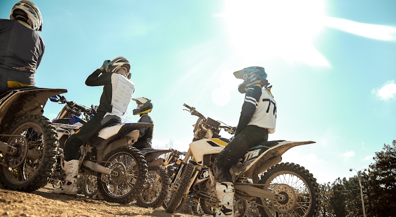 group of friends with dirtbikes